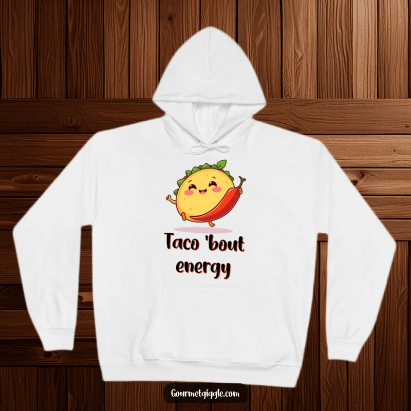 Funny hoodie featuring a smiling taco kicking a dancing chili pepper, offering cozy comfort and vibrant fiesta-themed humor.